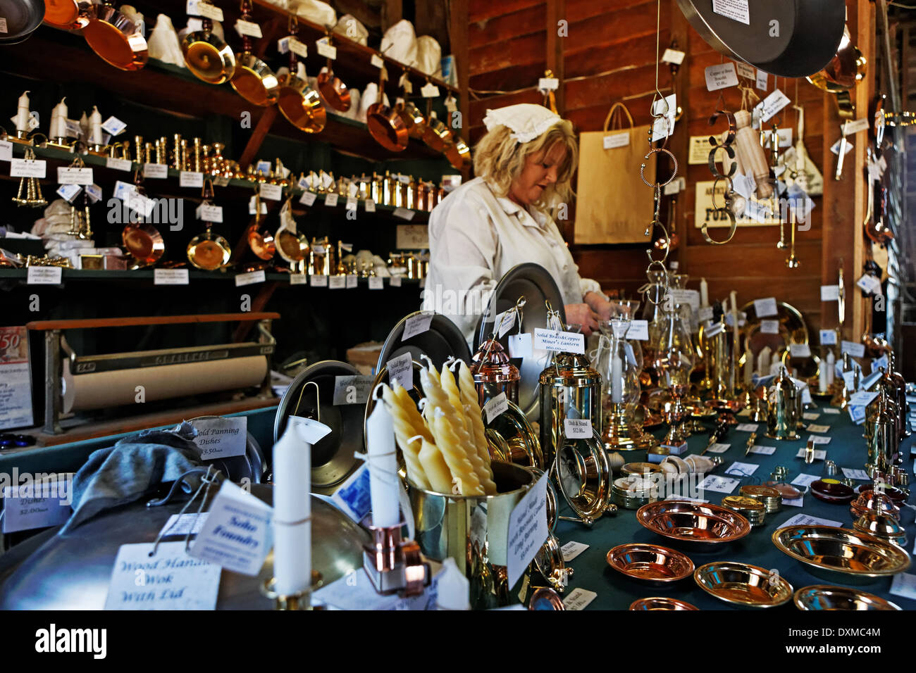 Woman in period costume in a craft shop at Sovereign Hill Mining Town, Ballarat, Australia Stock Photo