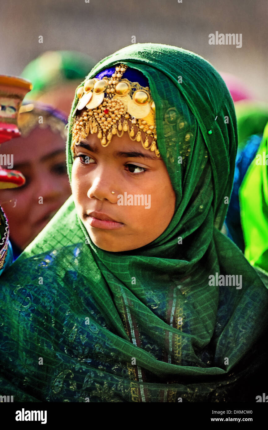 Omani girl wearing gold jewellery for the National Day celebrations. Digitally Manipulated Image. Stock Photo