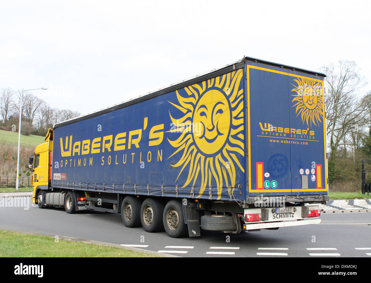 A Waberer's truck traveling around a roundabout in Coulsdon, Surrey, England Stock Photo