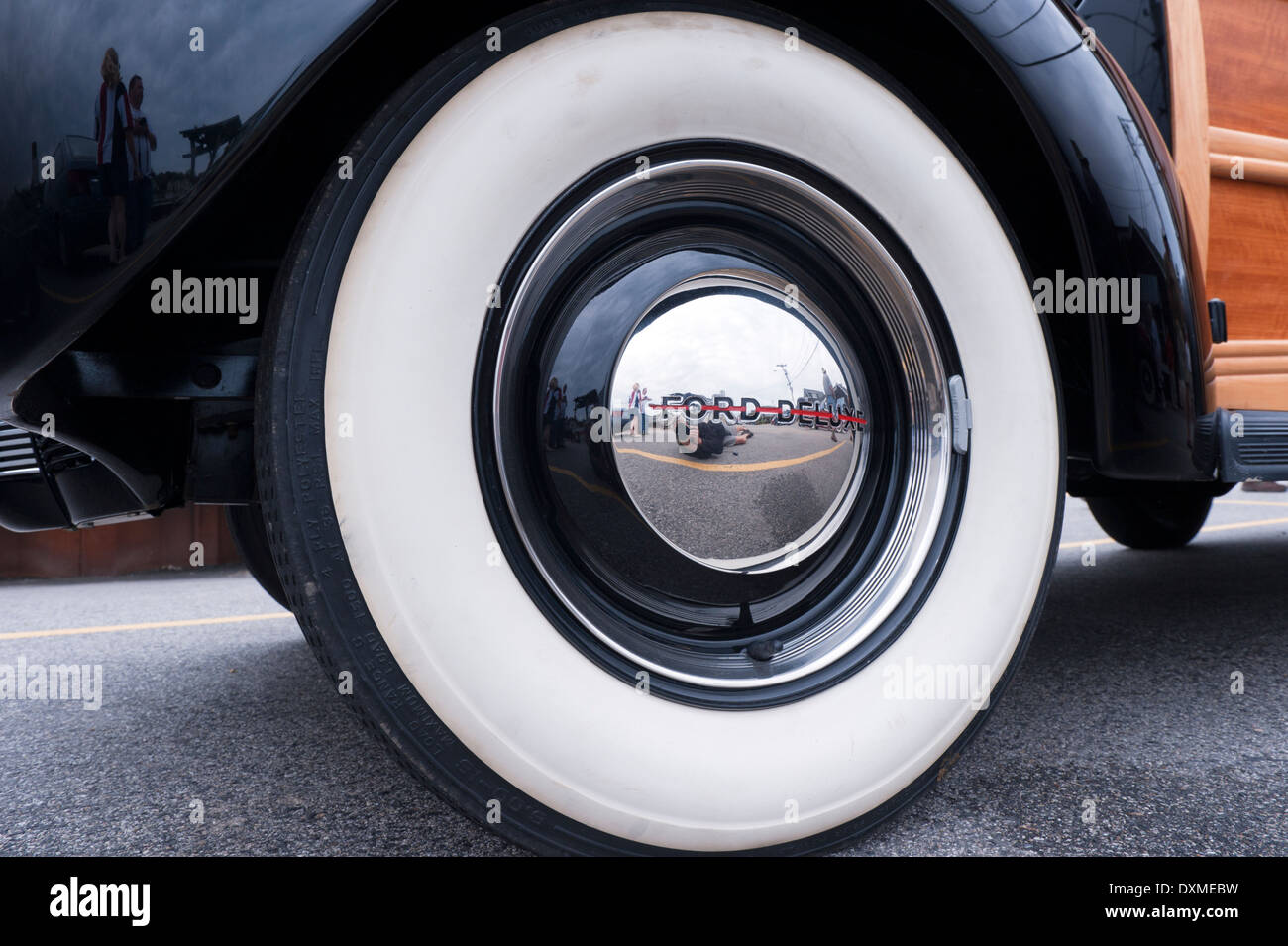 Closeup of a white wall tire on a Ford Deluxe woodie station wagon. Stock Photo