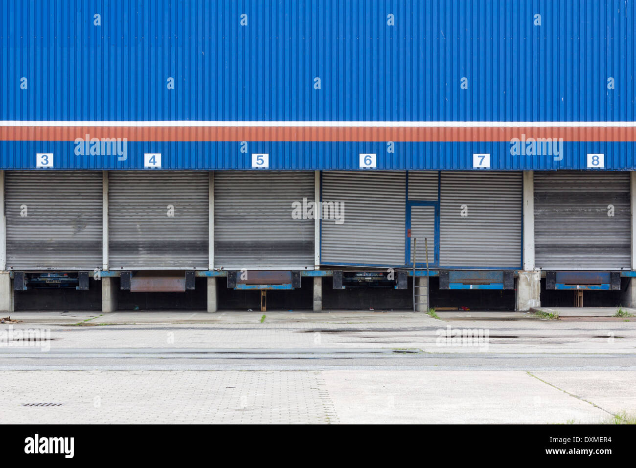 Shuttered and abandoned blue industrial loading dock. Stock Photo