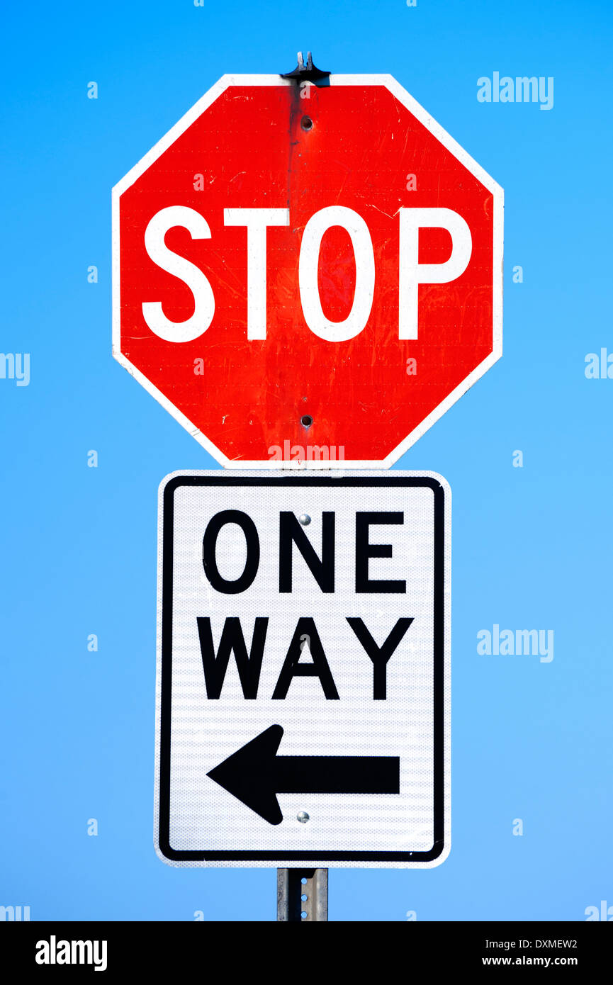 Stop and one way signs on the same signpost. Stock Photo
