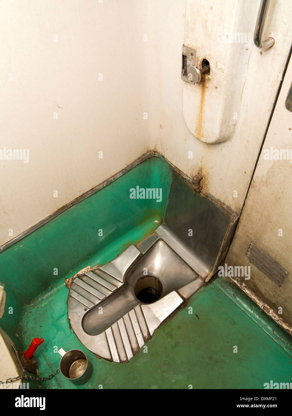 India, Rail Travel, 2nd class 2 tier air conditioned 2A carriage toilet interior, squat lavatory Stock Photo