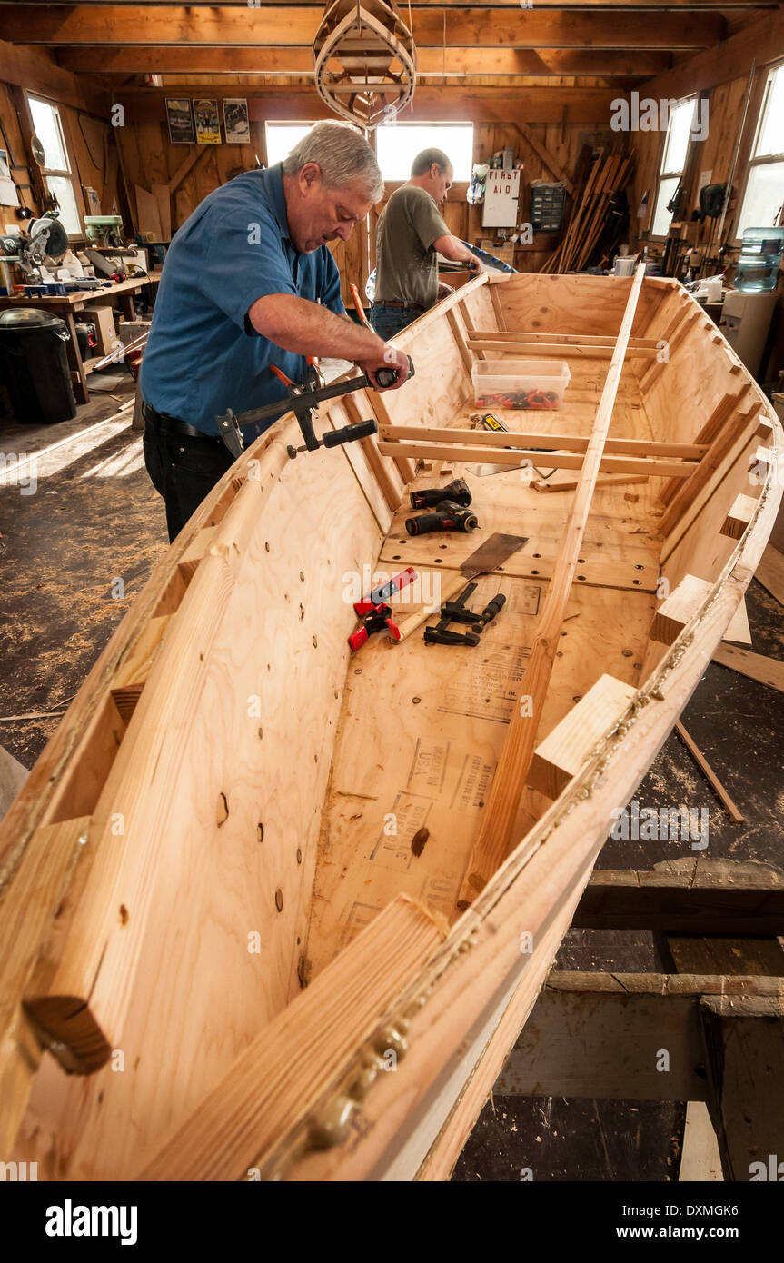 Building a wooden boat at the Port of Toledo Community Boathouse; Toledo, Oregon. Stock Photo