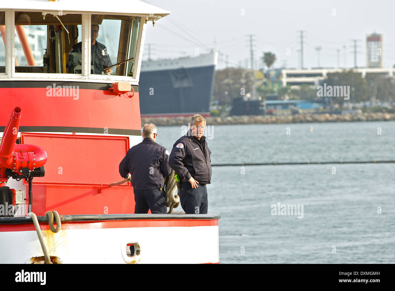 Fireboat 'Challenger' approaches the dock in Rainbow Harbor, Long Beach, California Stock Photo