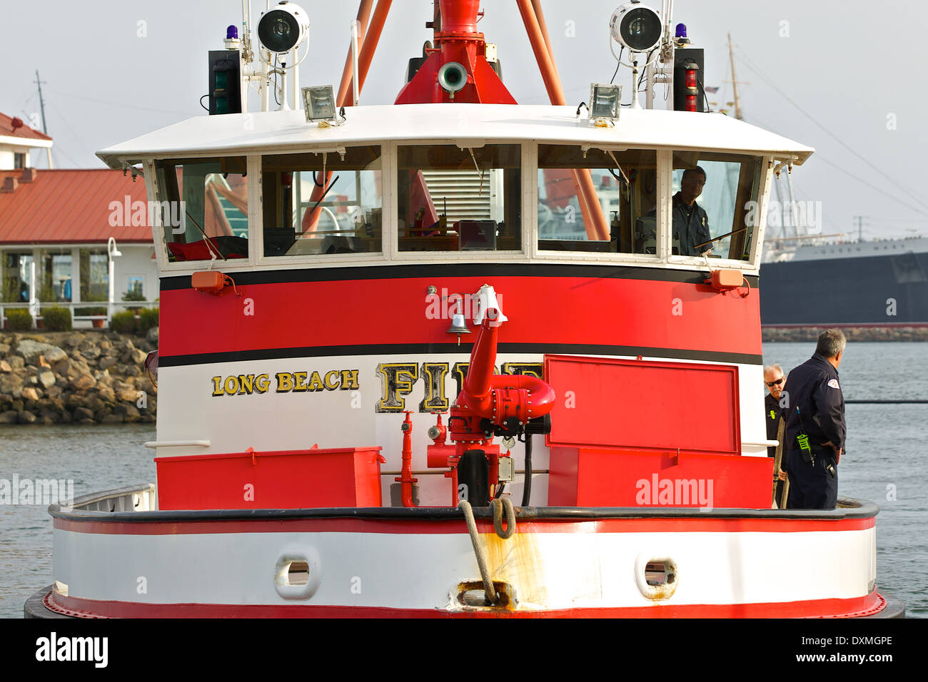 Fireboat Challenger approaches the dock in Rainbow Harbor, Long Beach, California. Stock Photo