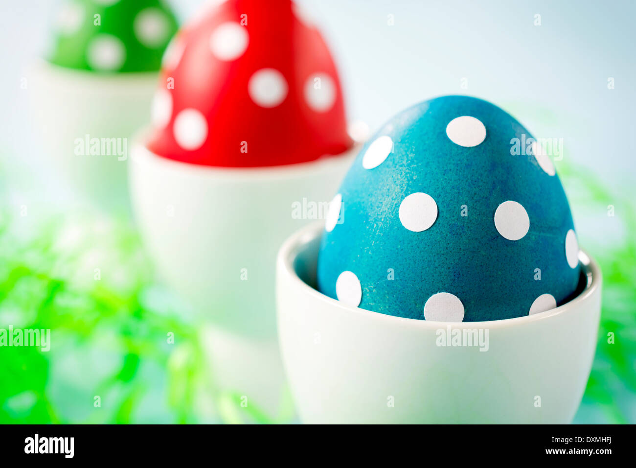 Dotted Eastern eggs,selective focus on the front blue egg. Stock Photo