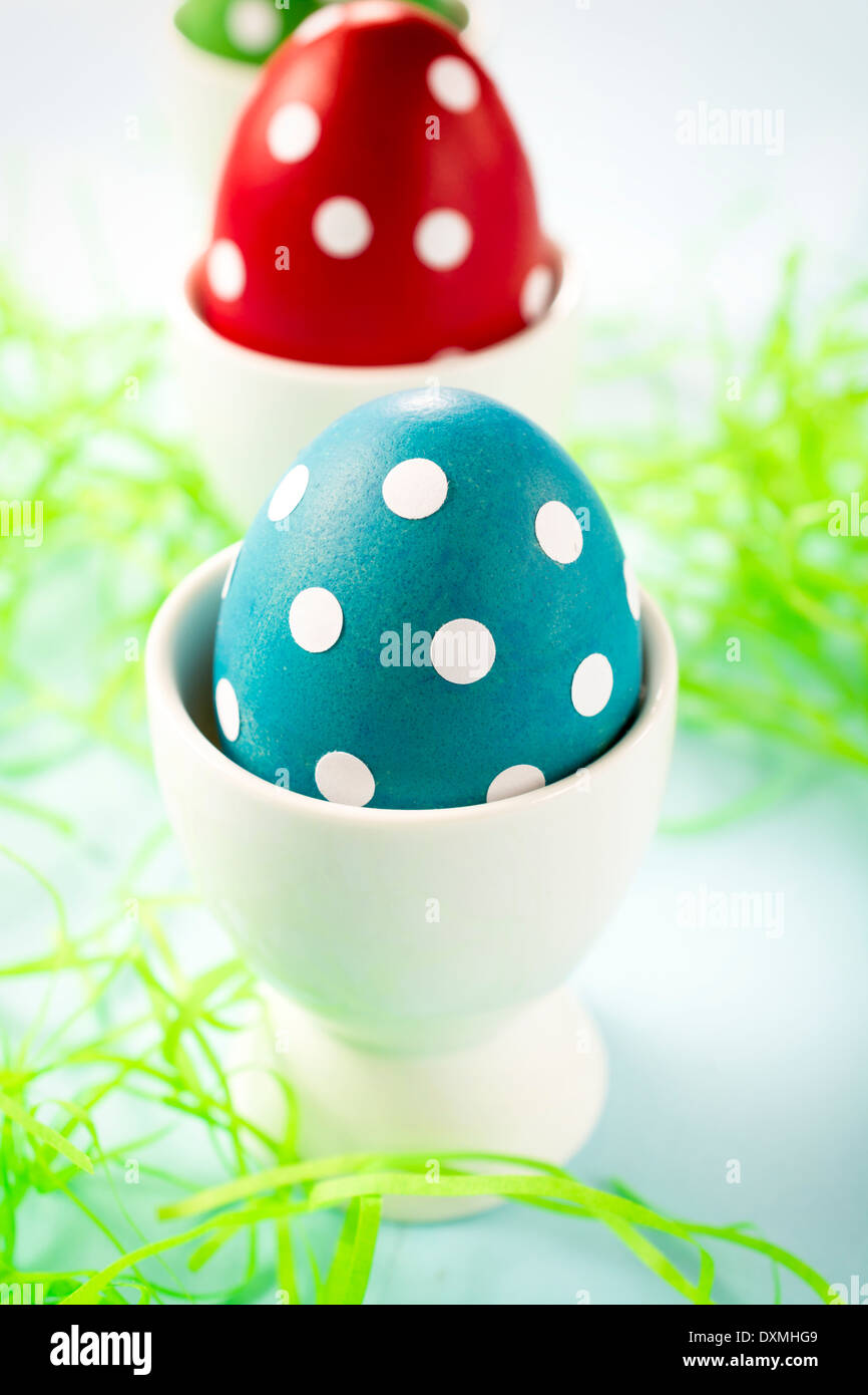Selective focus on the front dotted blue Easter egg Stock Photo