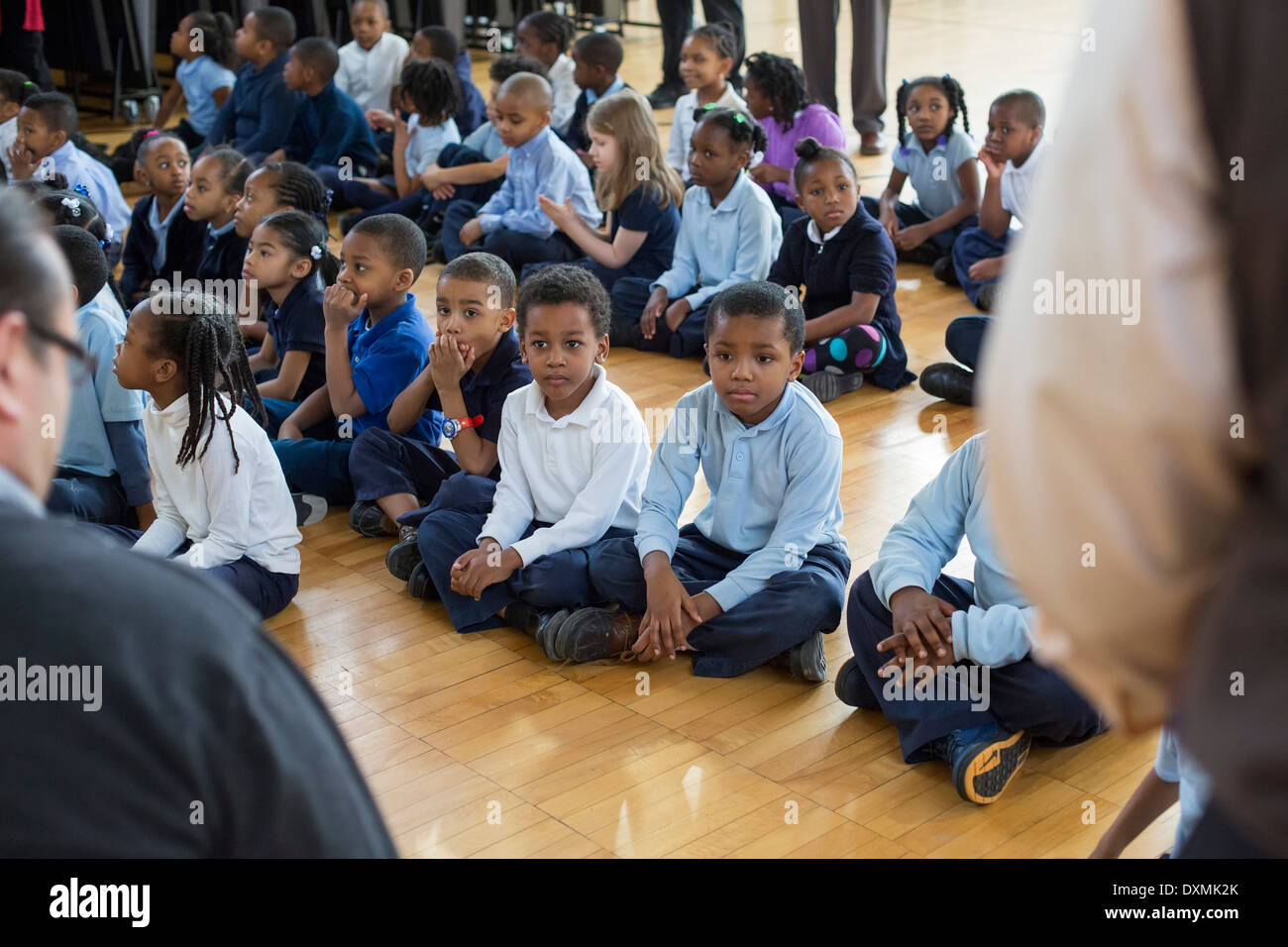 Kindergarten and first grade students at Chrysler Elementary School listen as a children's book is read. Stock Photo
