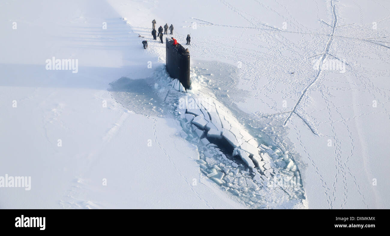 Aerial view of the US Navy Virginia-class nuclear attack submarine USS New Mexico surfaces through the arctic ice during training exercise ICEX 2014 March 22, 2014 off the coast of Alaska. Stock Photo