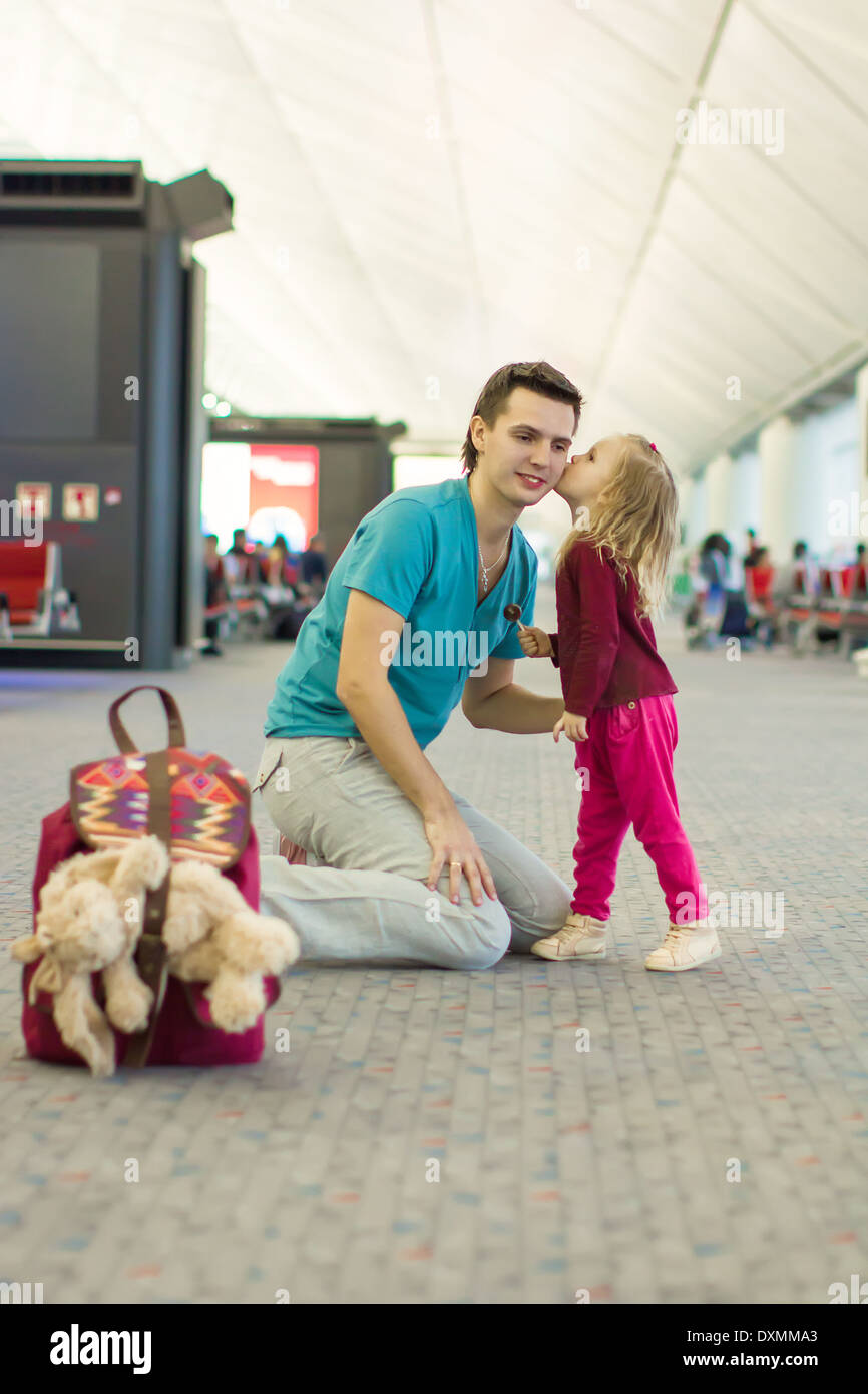 Little adorable girl and young father walking in the airport Stock ...