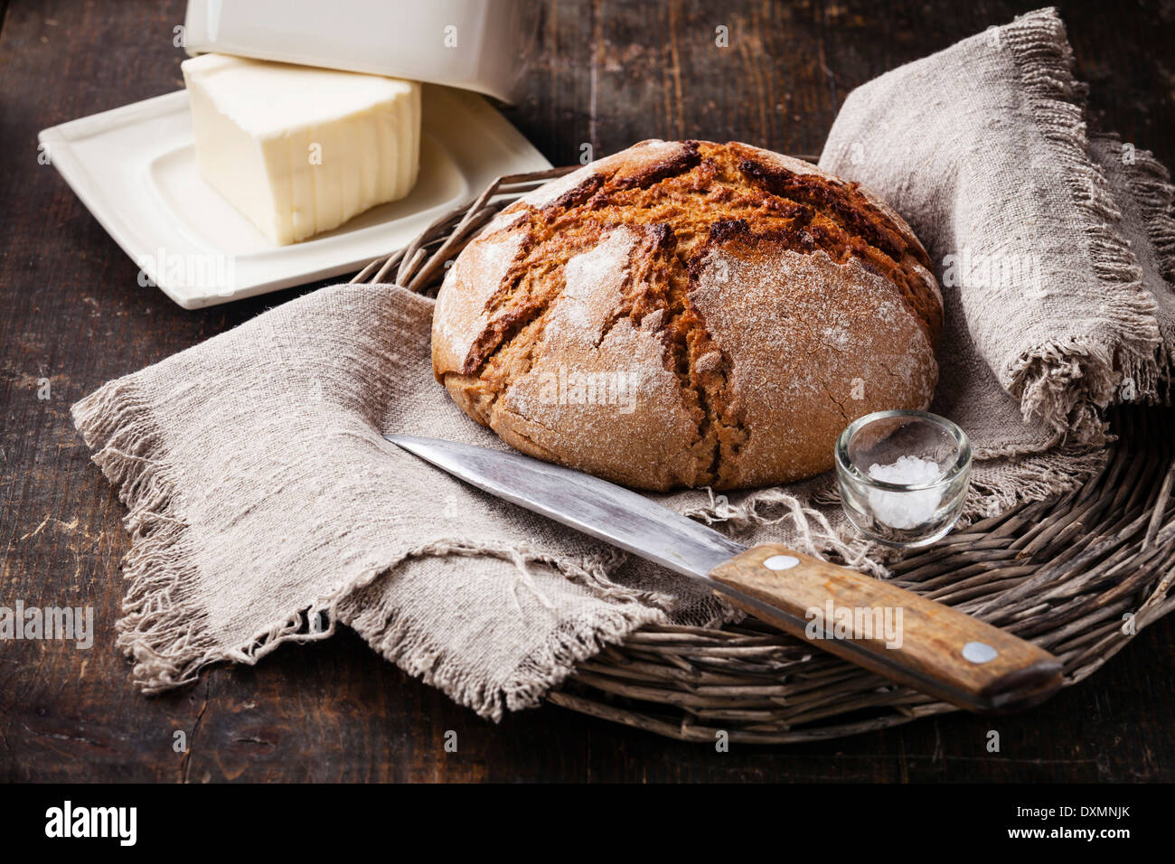 Rye bread and butter on wooden table Stock Photo