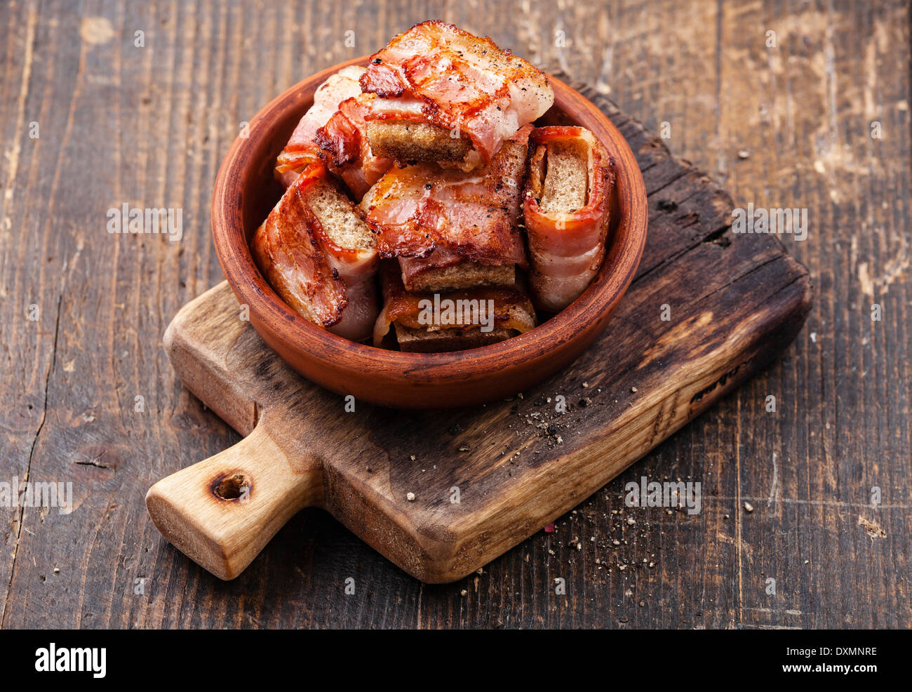 Appetizer bread slices fried in bacon Stock Photo