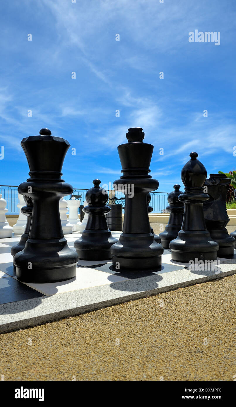 Life Size Chess Pieces On A Board Outside At A Hotel Pool Side Stock Photo  - Download Image Now - iStock