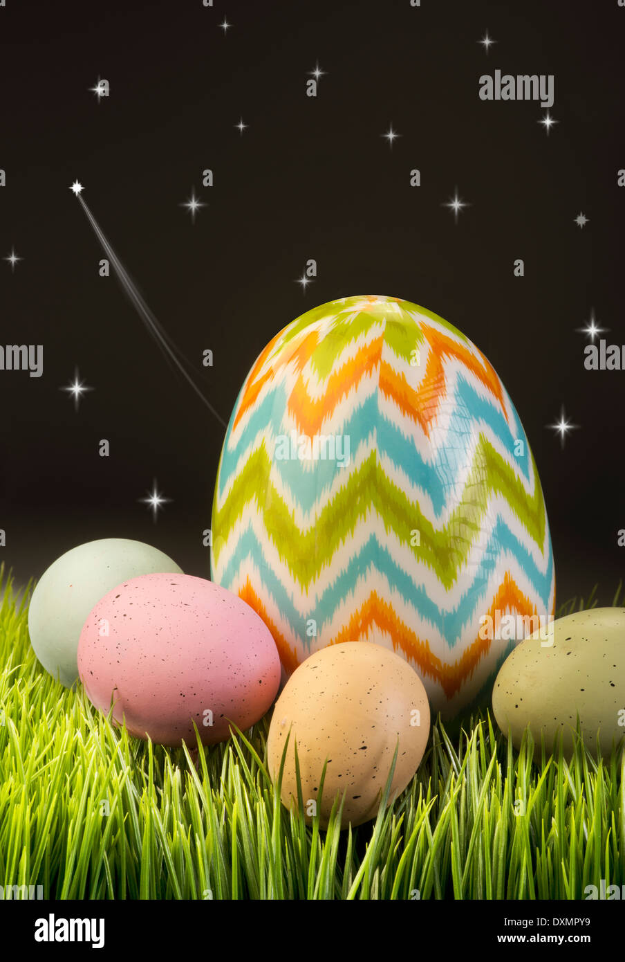 Easter eggs at night with stars streaking. Stock Photo