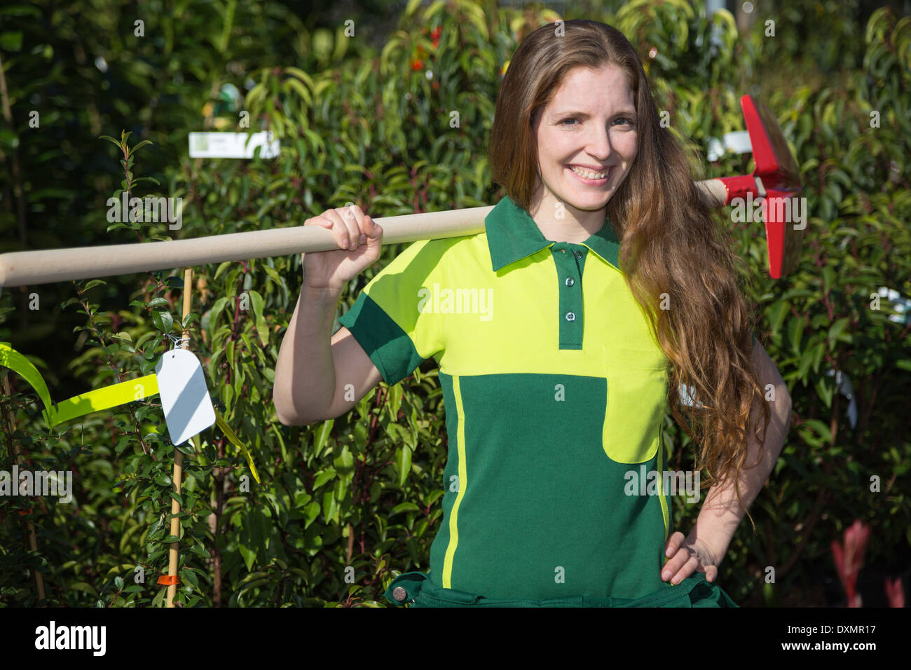 Farmer or gardener posing with shovel in garden nursery Stock Photo - Alamy