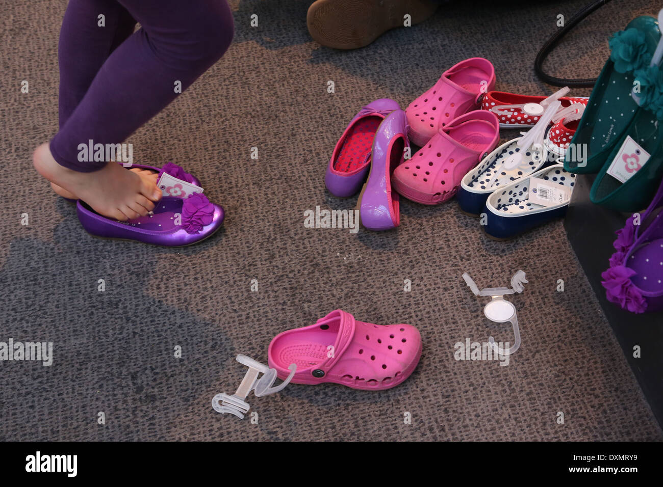 Kingston Upon Thames Surrey John Lewis Store Girl Trying On Purple Ballet Pump Shoes Stock Photo