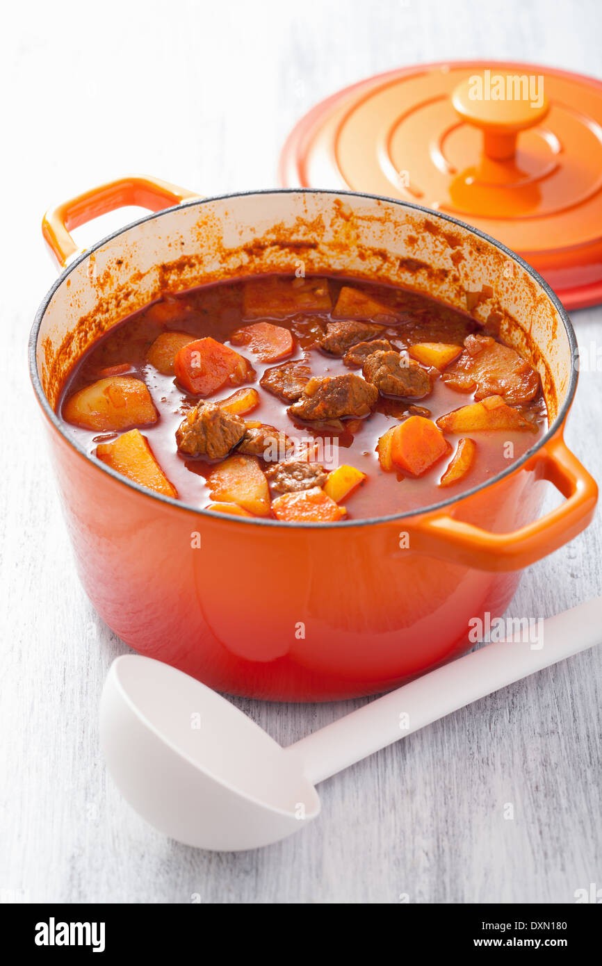 beef stew with potato and carrot in red casserole Stock Photo Alamy