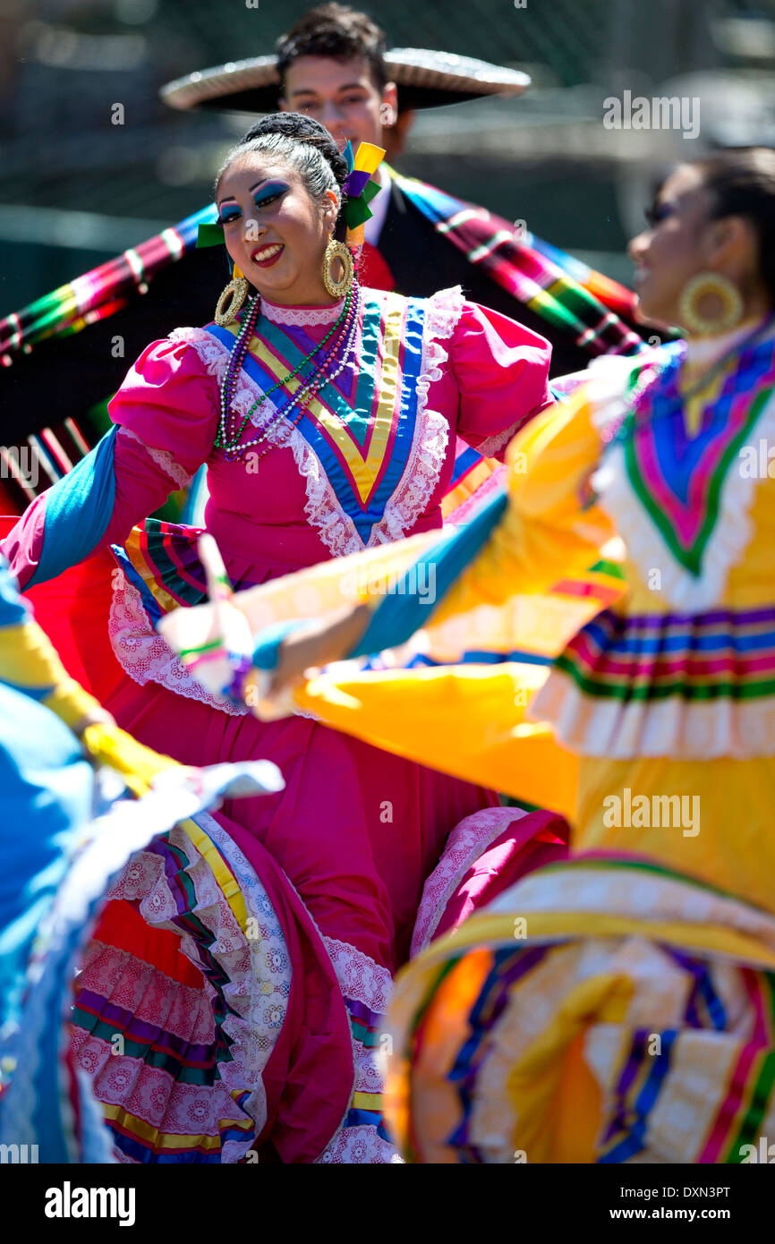 A group of Mexican folk dancers performs a traditional dance Stock Photo