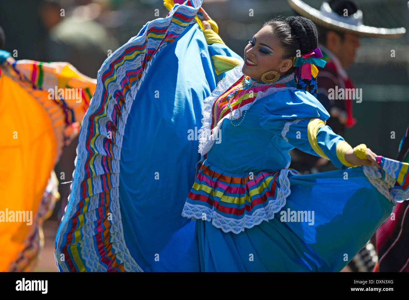 A group of Mexican folk dancers performs a traditional dance Stock Photo