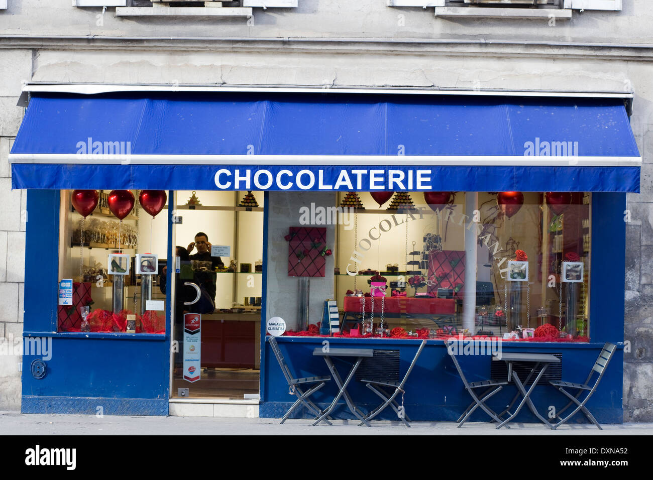 Sign and Awning Entrance to Café on the streets of Paris France Stock Photo