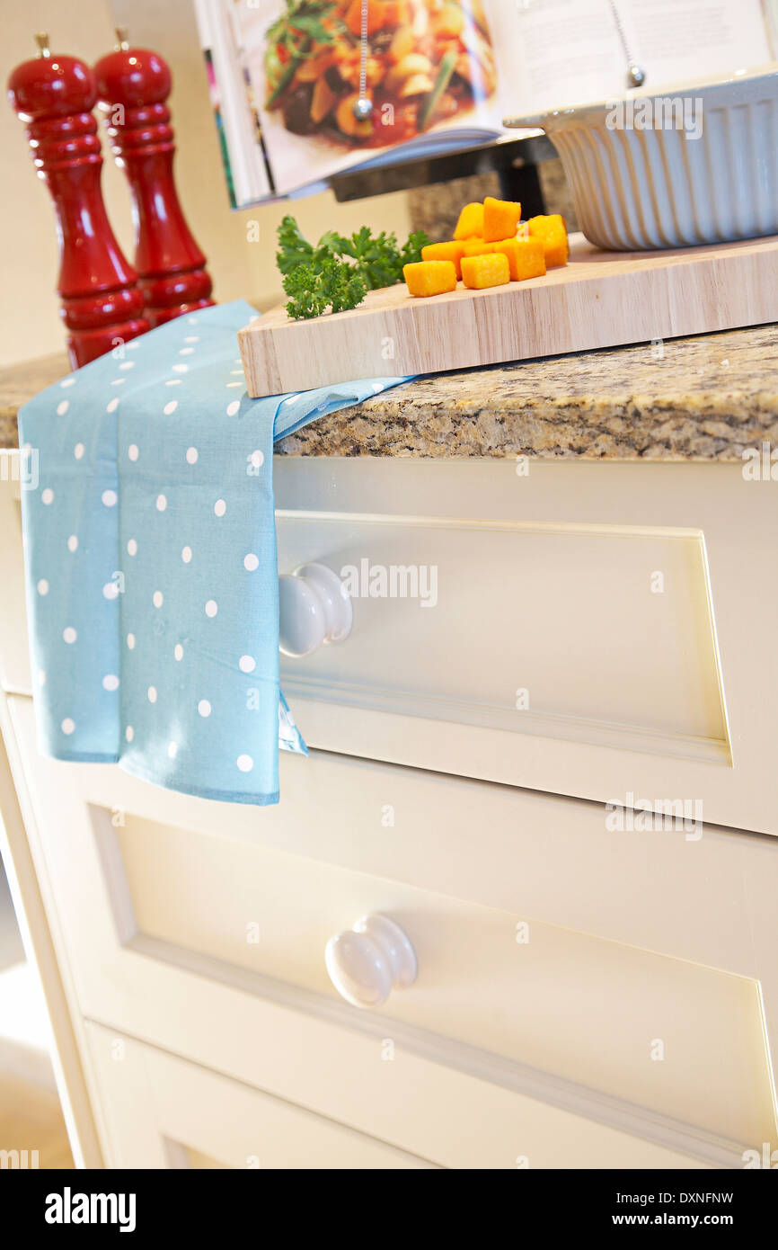 Food preparation of a recipe in a book in a modern kitchen in a house in the UK. Stock Photo