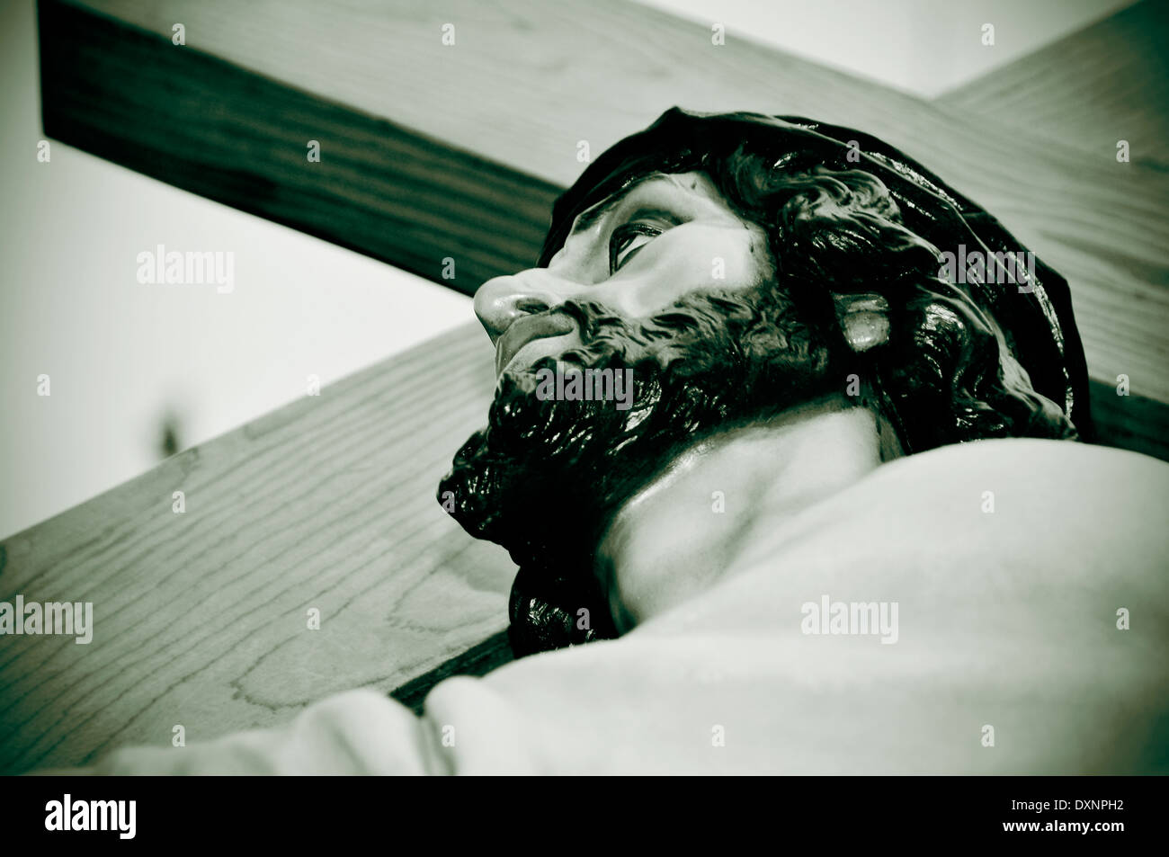 A Figure Of Jesus Christ Carrying The Holy Cross In Black And White