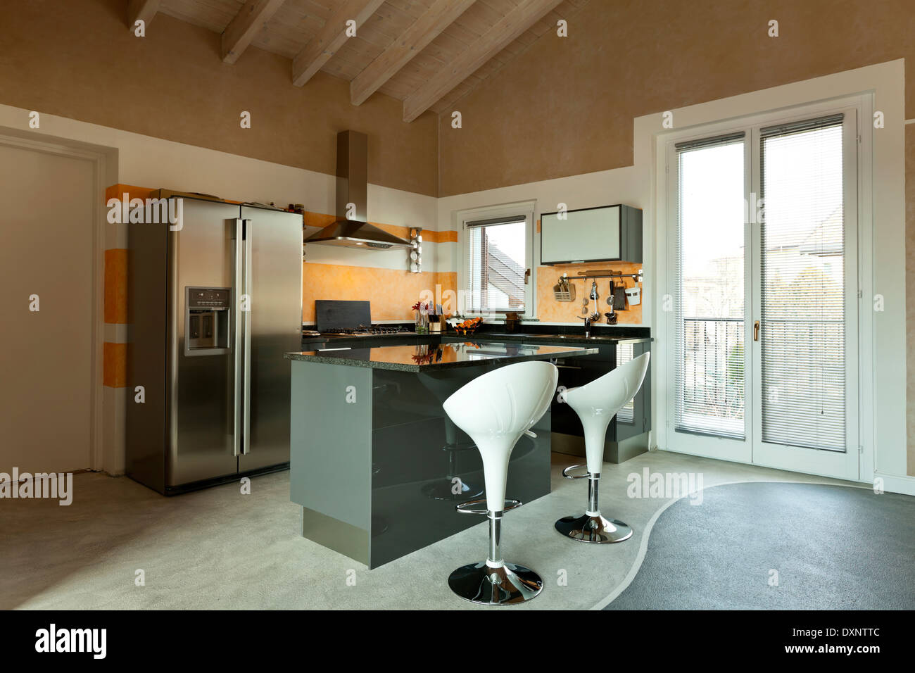 interior, new loft furnished, kitchen island with two stools Stock Photo