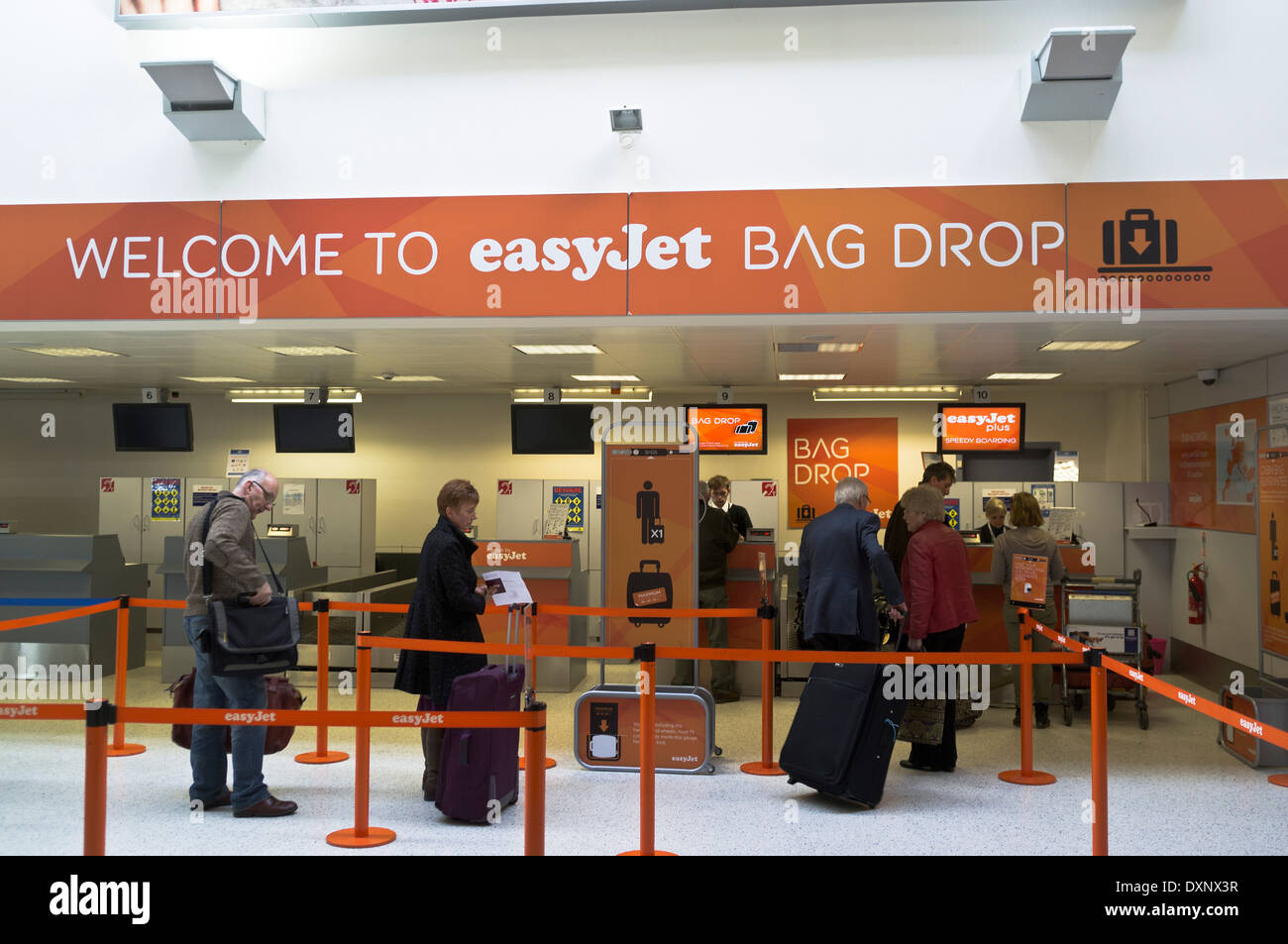 dh Airport INVERNESS INVERNESSSHIRE EasyJet Bag Drop passengers checkin air flight luggage check in Scotland uk checking baggage desk airports Stock Photo