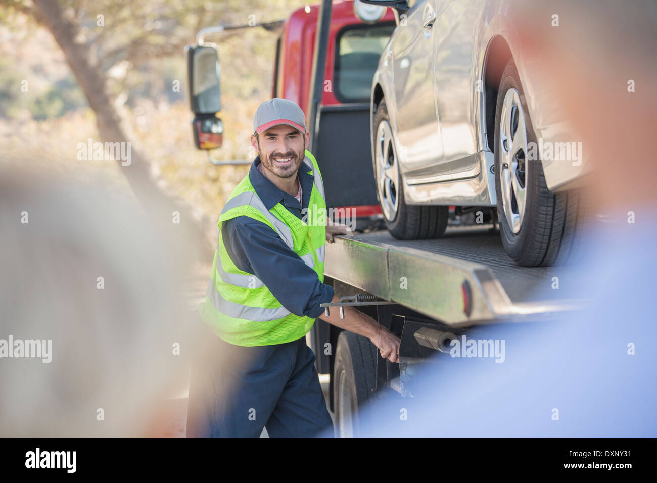 Roadside mechanic towing car for senior couple Stock Photo