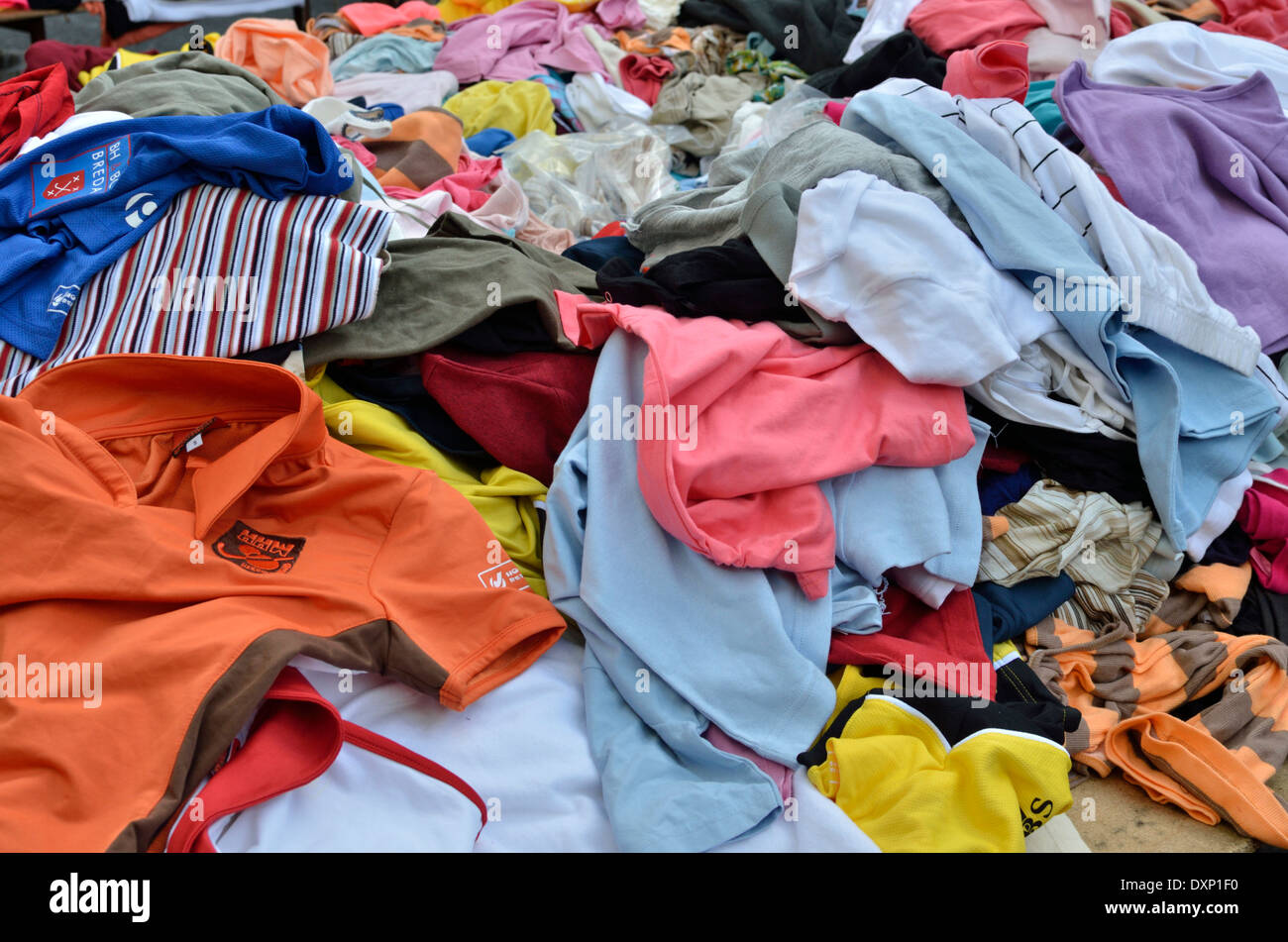 A pile of second hand clothes on a market stall, London, UK Stock Photo