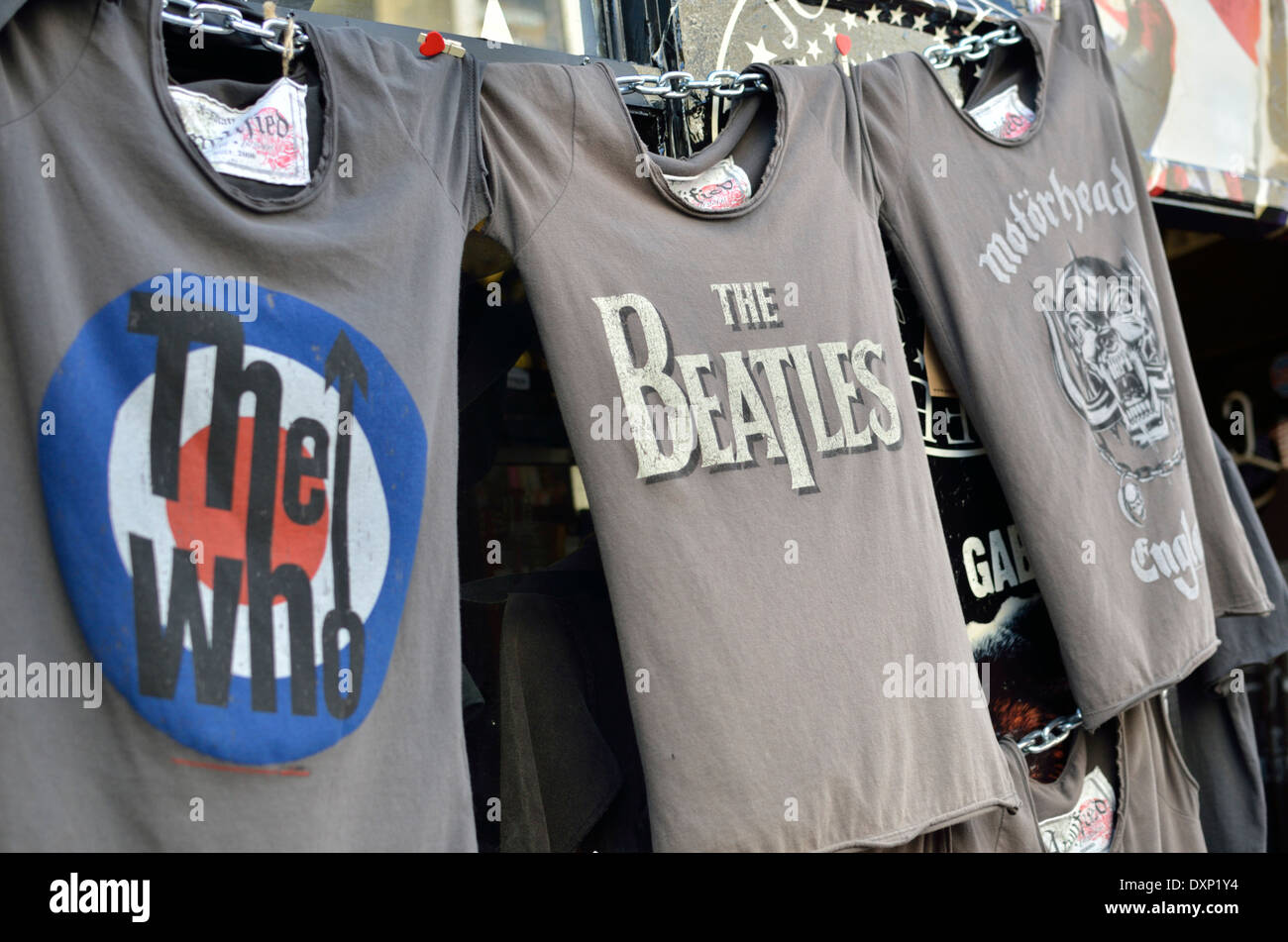 Classic British pop group logos on t-shirts in a market, London, UK Stock Photo