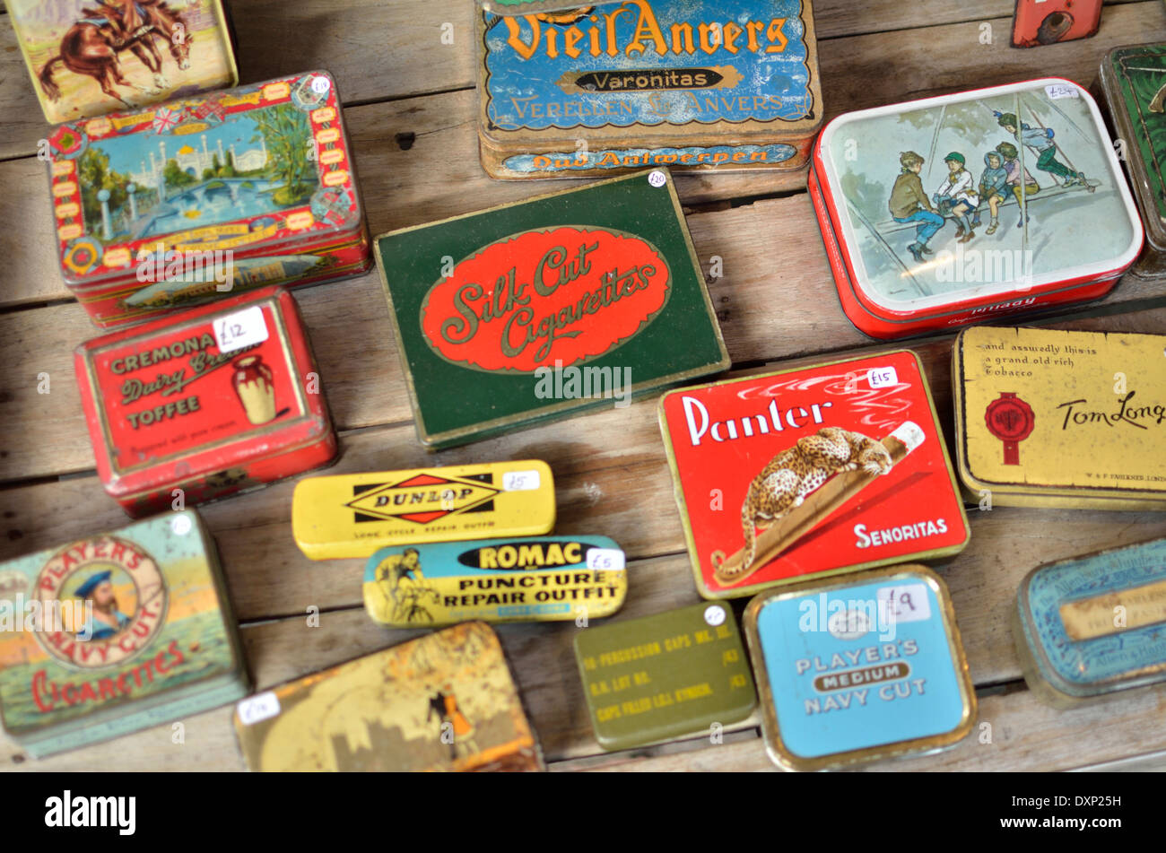 Colourful old tin boxes on a market stall, Portobello Road, Notting Hill, London, UK. Stock Photo