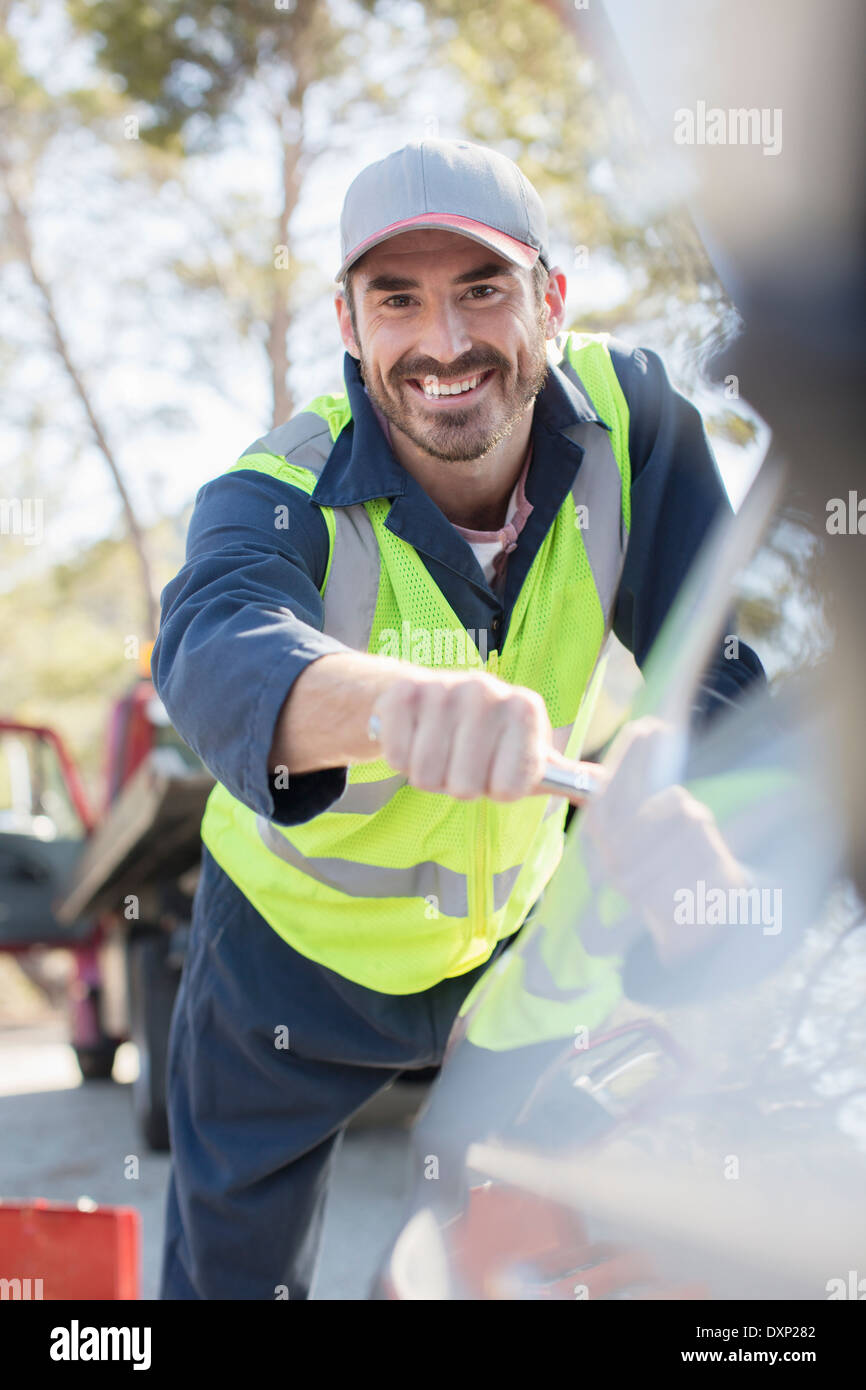 Portrait of smiling roadside mechanic Stock Photo