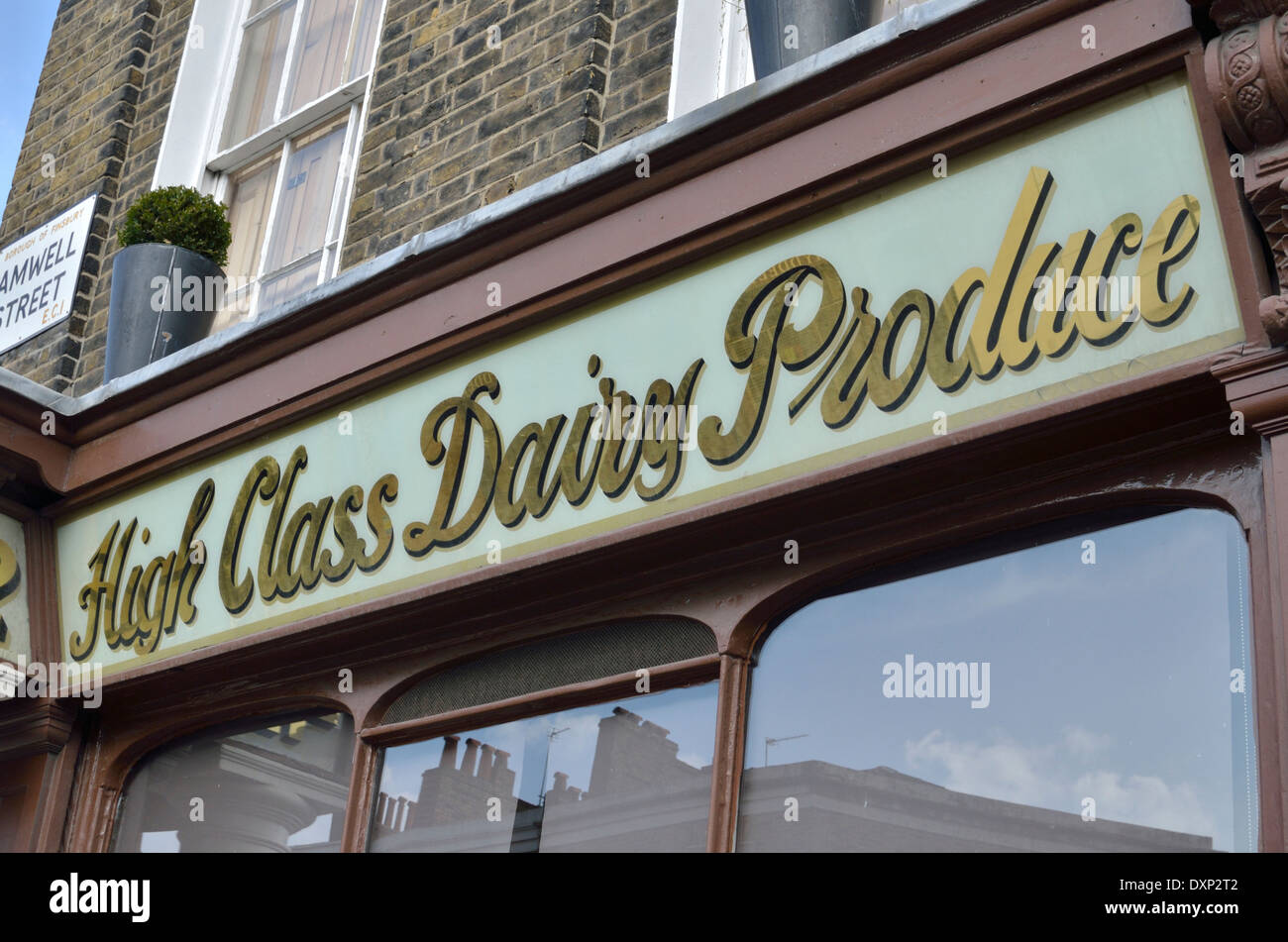 Old traditional ’High Class Dairy Produce’ sign outside Lloyd and Son, at number 42 Amwell Street, Islington, London, UK. Stock Photo