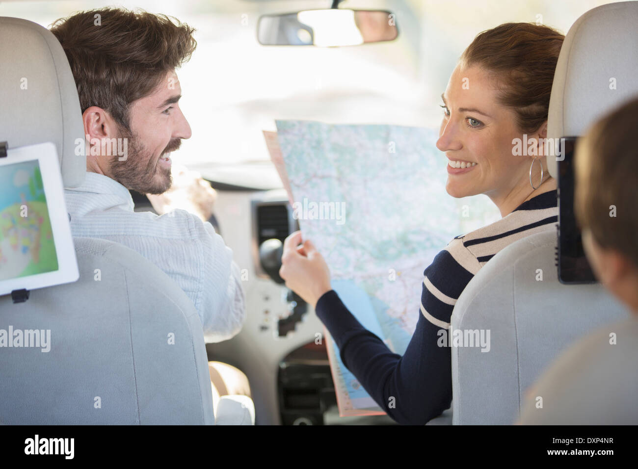 Family with map inside car Stock Photo