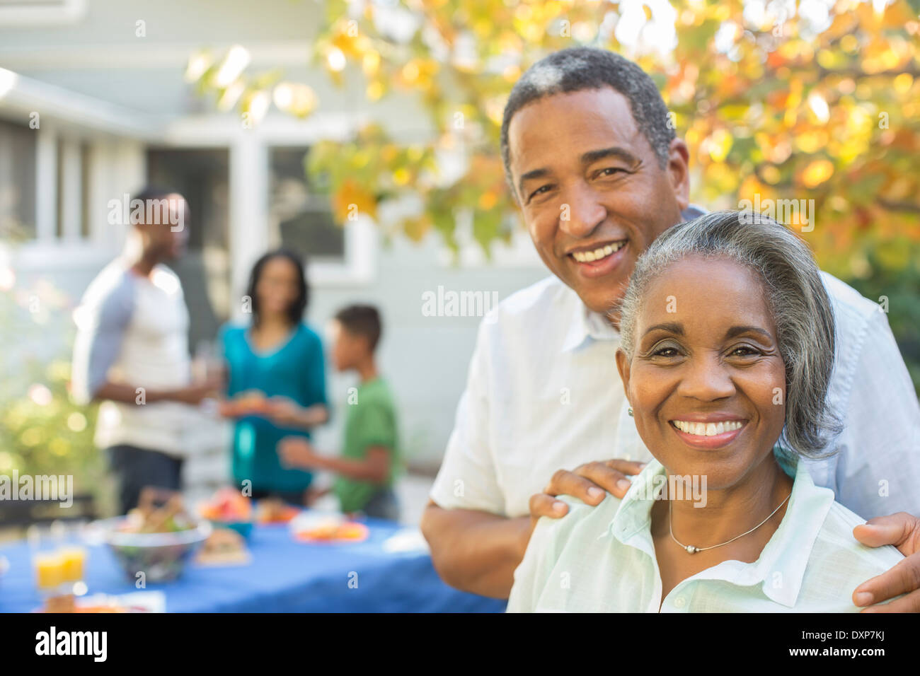 Portrait of smiling senior couple at barbecue Stock Photo