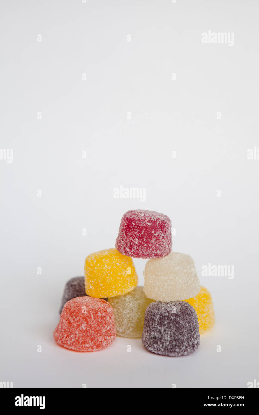 A pile of colourful American hard gums on a white background, with copy space above. Stock Photo