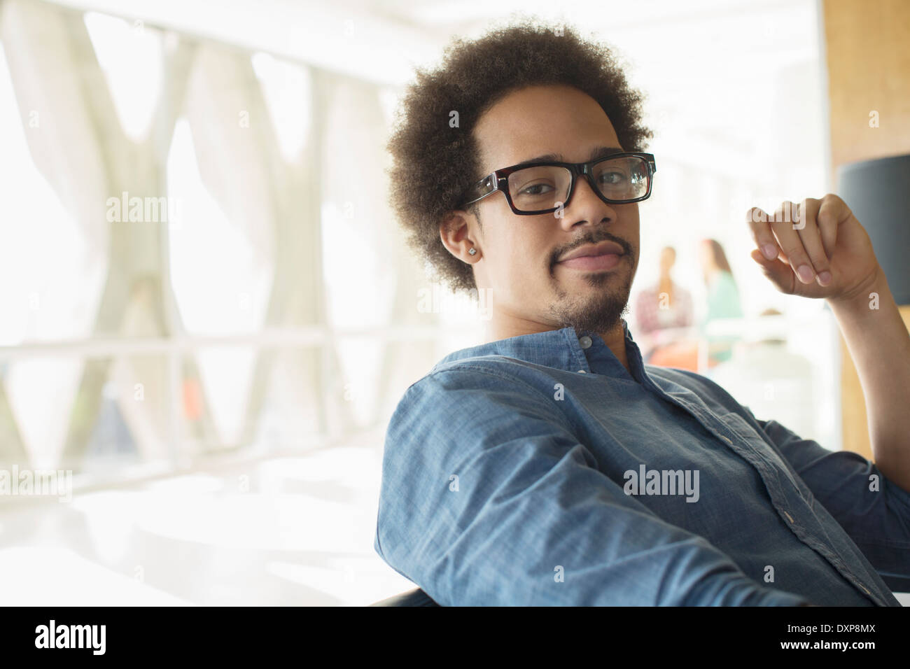 Portrait of confident casual businessman wearing eyeglasses Stock Photo