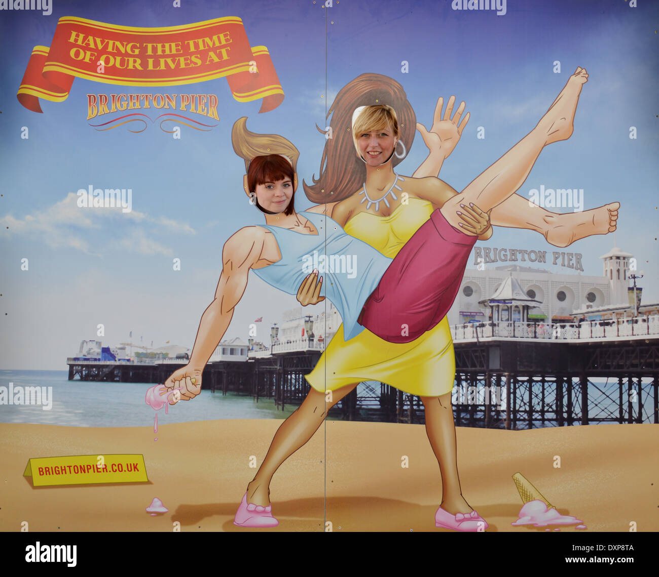 Two women in a fairground cartoon cut-out in Brighton, UK. Stock Photo