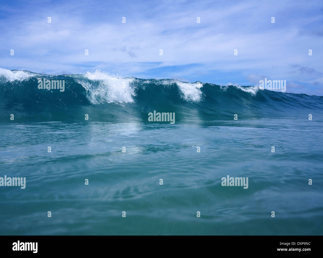 Ocean wave breaks viewed from the water surface Stock Photo