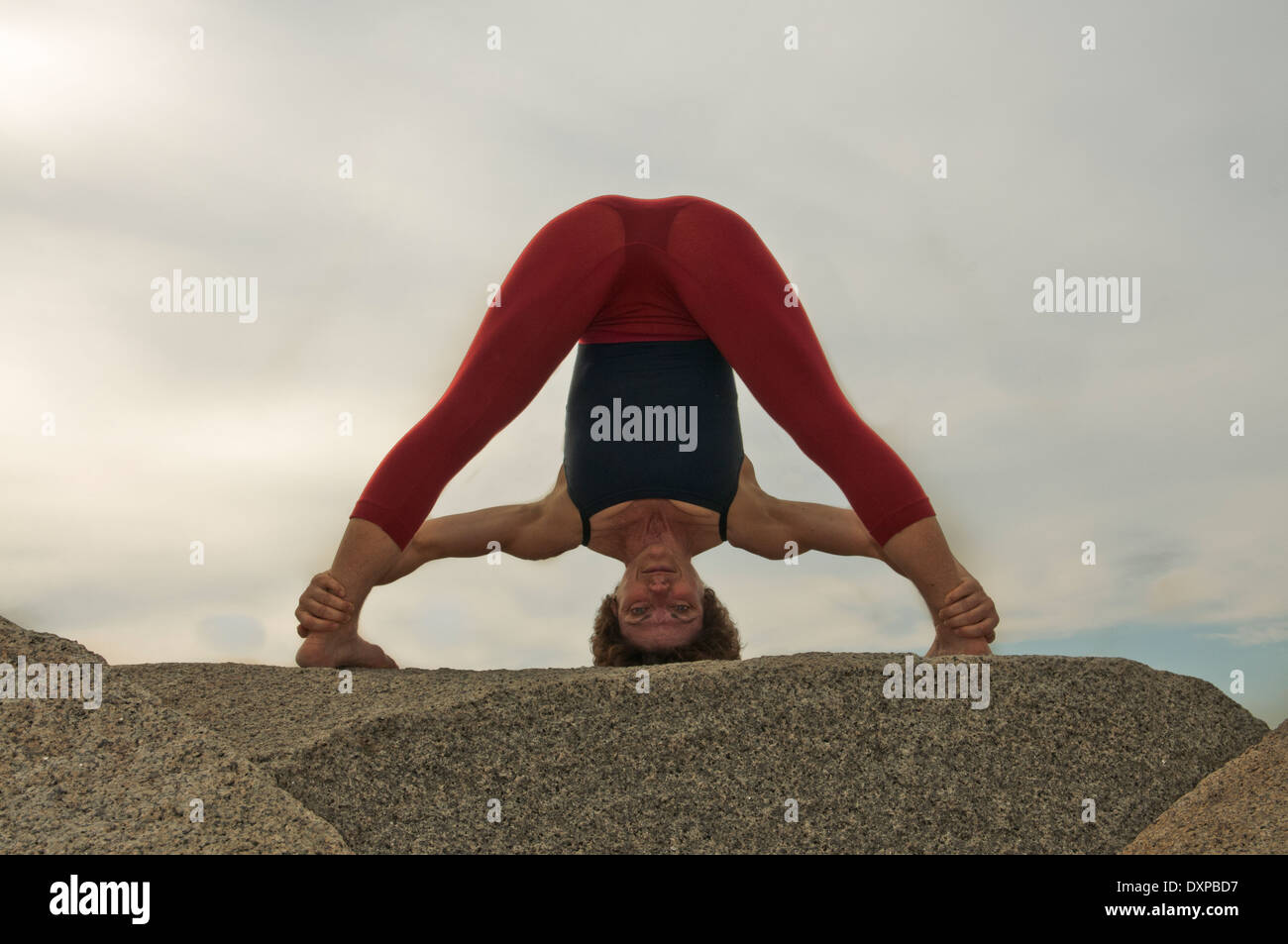 Iyengar Yoga Instructor Demonstrates Prasarita Padottanasana (Standing