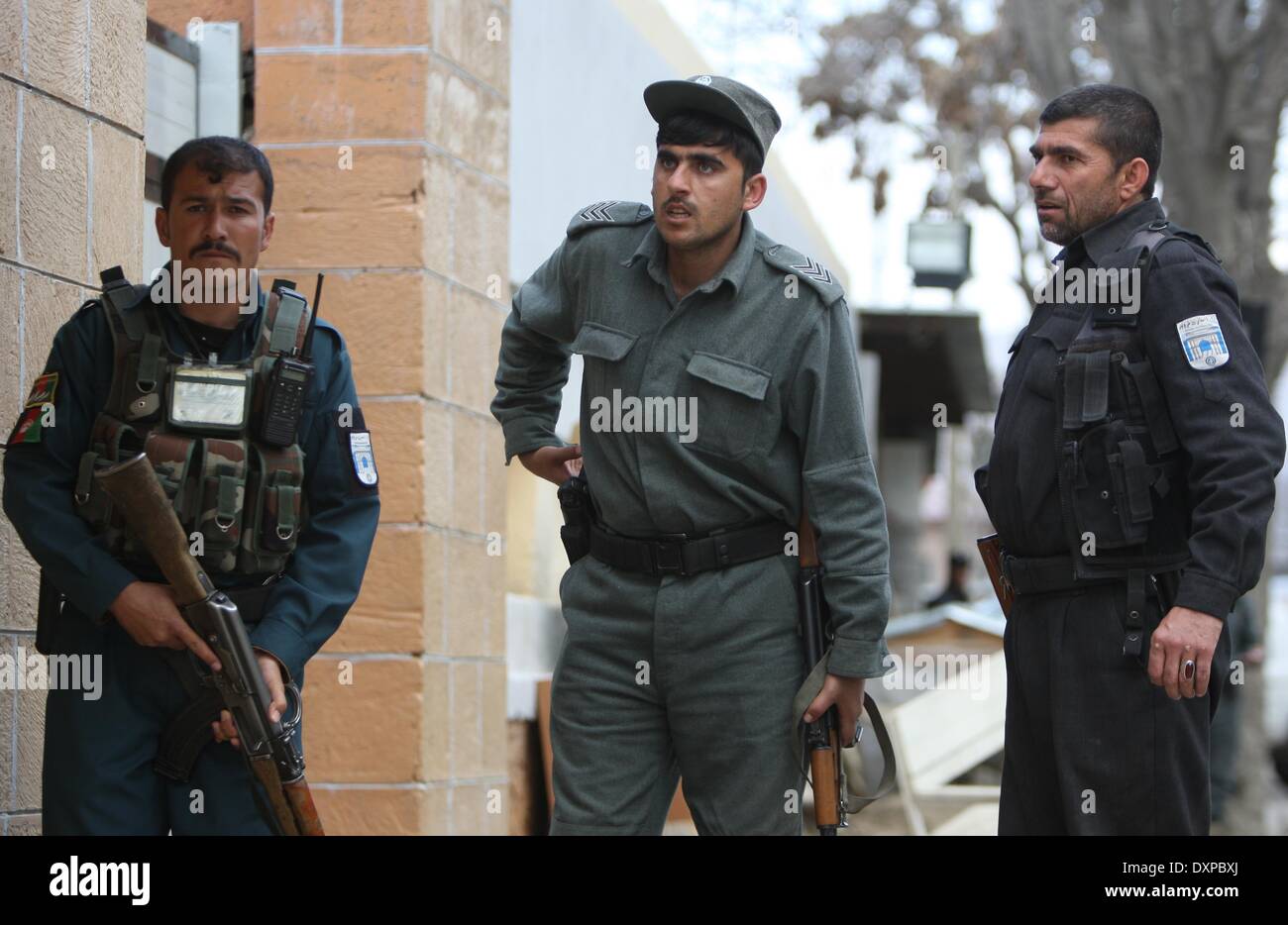 Kabul, Afghanistan. 28th Mar, 2014. Afghan policemen inspect the site of an attack in Kabul, Afghanistan on March 28, 2014. An explosion and ensuing gunshot targeted a guest house frequented by foreigners in Kabul on Friday, officials said. 'Four suicide bombers targeted the guest house in Kart-e-Char area in western Kabul. One attacker was killed after explosion of his car bomb at the door. Three militants made their way inside,' a security official told Xinhua. Credit:  Ahmad Massoud/Xinhua/Alamy Live News Stock Photo