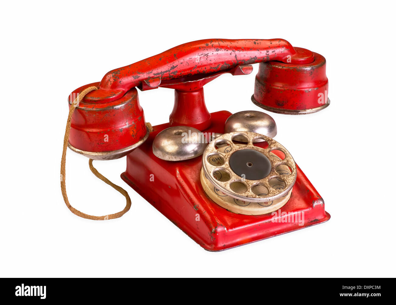Old red rotary phone. Stock Photo