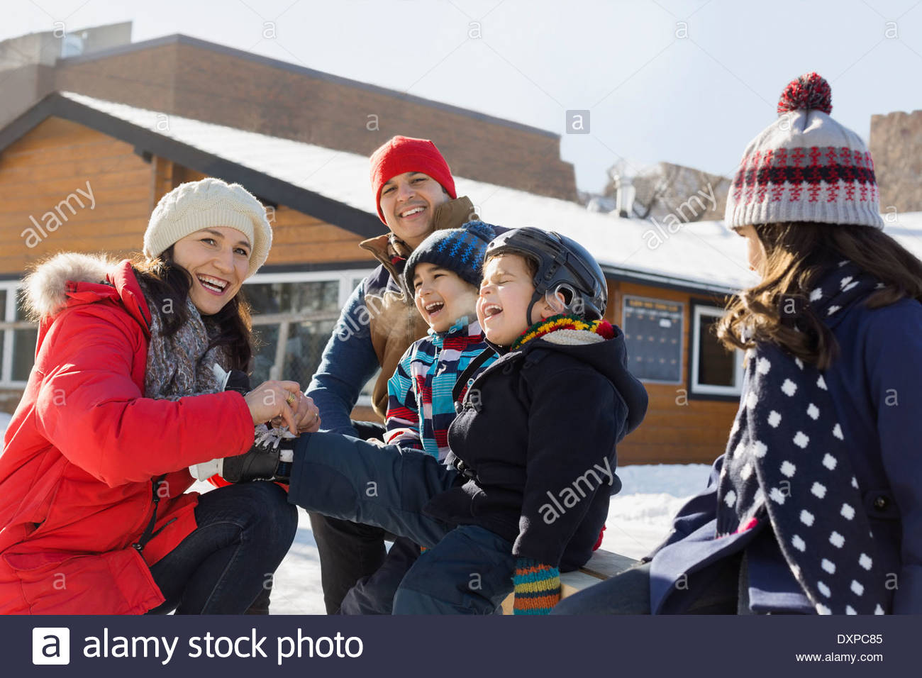 Family getting ready for ice-skating Stock Photo