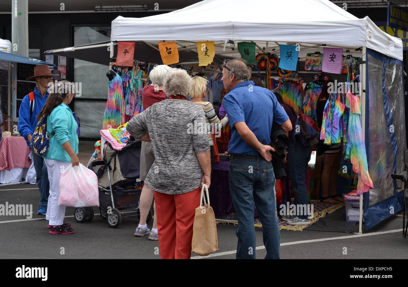 people browse a tie dye clothing market stall Stock Photo Alamy