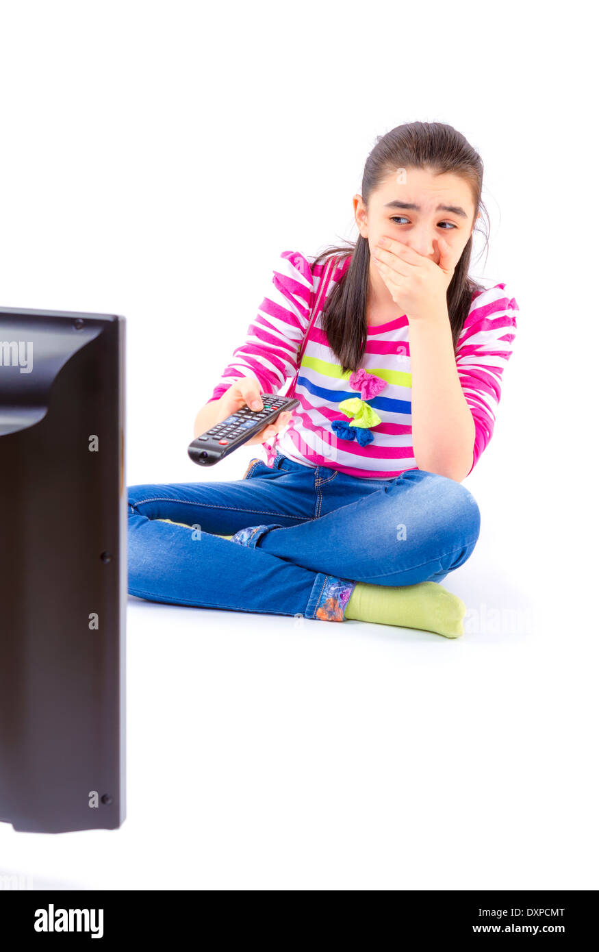 Scared little girl watching tv Stock Photo