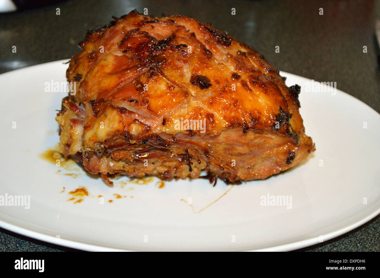honey roast gammon on a plate Stock Photo Alamy
