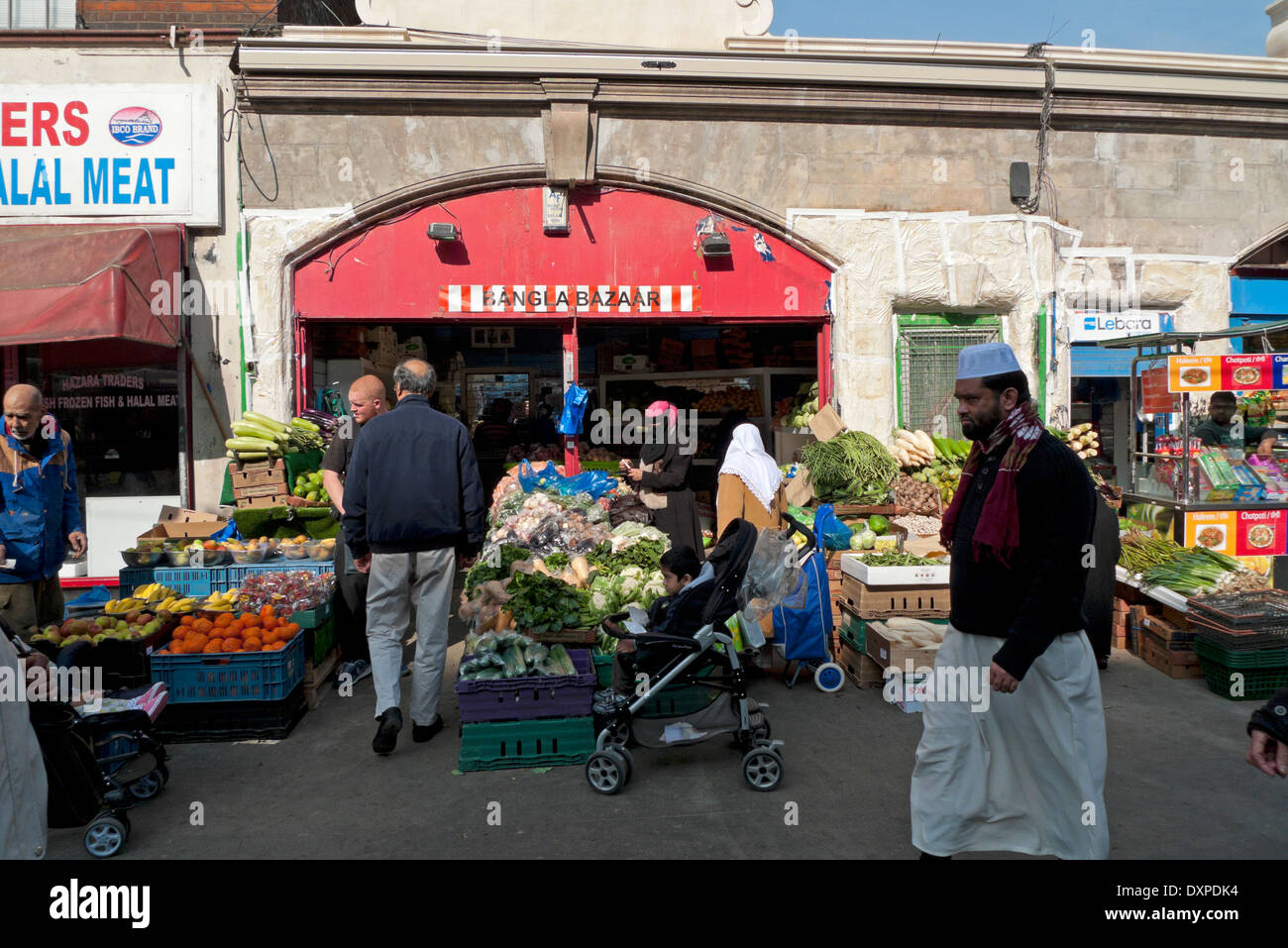 People buying fruit and veg at Bangla Bazaar in Whitechapel Road Market  East London E1 UK KATHY DEWITT Stock Photo - Alamy