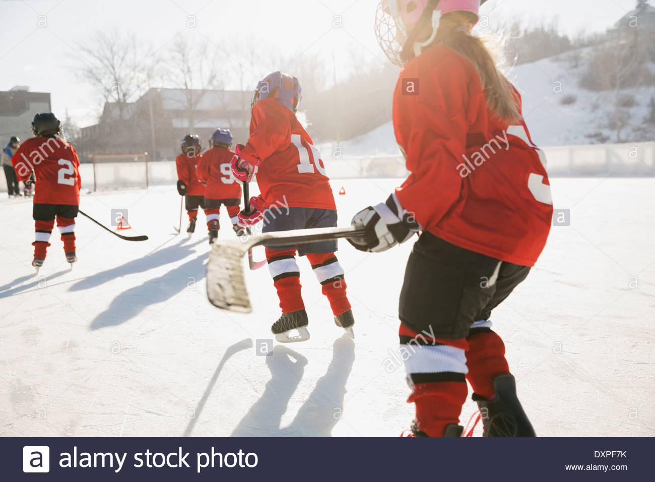 Ice hockey team skating on outdoor rink Stock Photo Alamy
